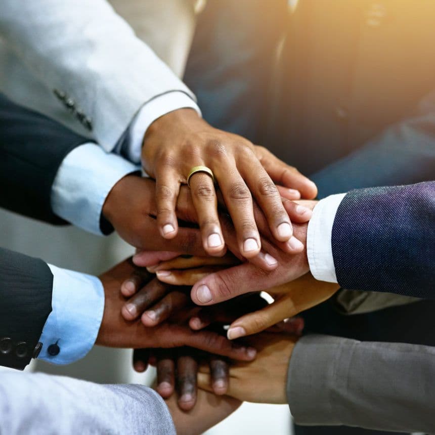 Team workspace with laptops and notebooks